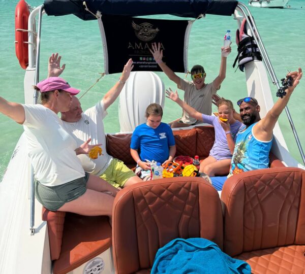 Family enjoying a private Red Sea boat trip near Orange Bay from Hurghada
