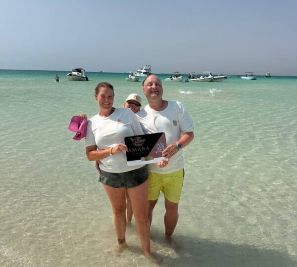 Guests enjoying the clear Red Sea water on an Orange Bay boat trip from Hurghada