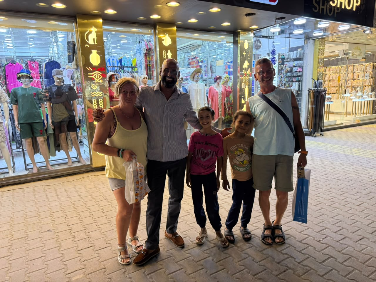 Family and guide visiting a local bazaar in Egypt